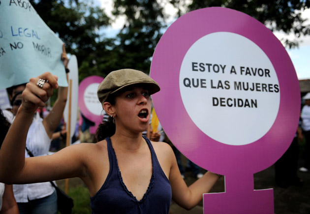 Nicaraguan activists take part in a protest in favour of abortion during the Day for the Decriminalization of Abortion in Latin America and the Caribbean, in Managua, on September 28, 2011. The sign reads "I am in favour of women to decide". AFP PHOTO/ ELMER MARTINEZ